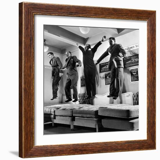 The Salesmen Showing How Not to Test a Bed at Lewis and Conger-George Silk-Framed Photographic Print