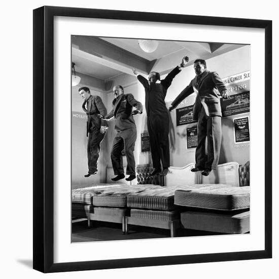 The Salesmen Showing How Not to Test a Bed at Lewis and Conger-George Silk-Framed Photographic Print