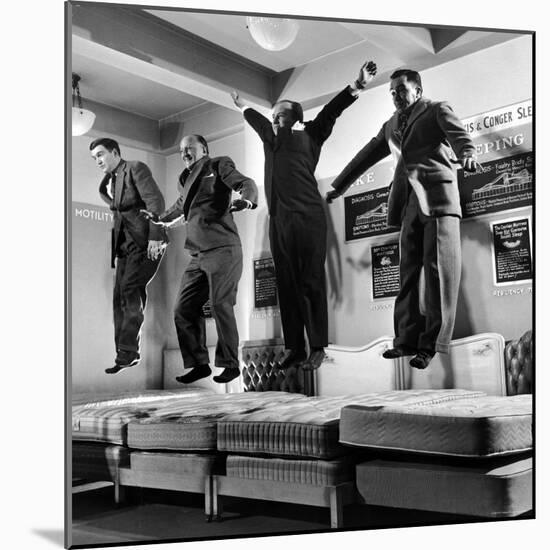 The Salesmen Showing How Not to Test a Bed at Lewis and Conger-George Silk-Mounted Photographic Print