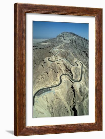 The serpentine new road to the summit of Jebel Hafit mountain near the al-'Ain oasis-Werner Forman-Framed Giclee Print