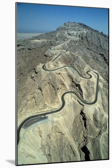The serpentine new road to the summit of Jebel Hafit mountain near the al-'Ain oasis-Werner Forman-Mounted Giclee Print
