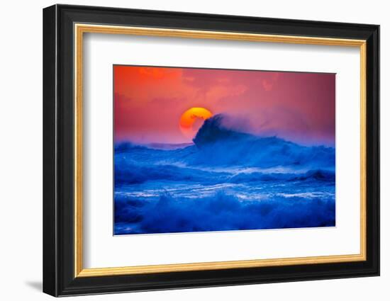 The setting sun and large winter waves breaking off the north coast of Kauai, Hawaii-Mark A Johnson-Framed Photographic Print