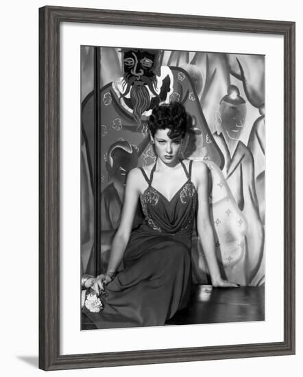 The Shanghai Gesture, Gene Tierney Wearing a Costume Designed by Oleg Cassini, 1941-null-Framed Photo