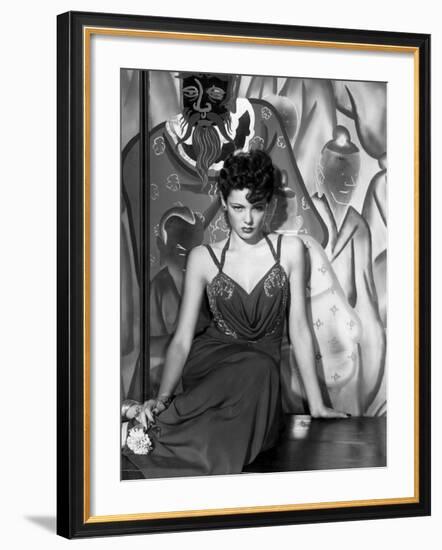 The Shanghai Gesture, Gene Tierney Wearing a Costume Designed by Oleg Cassini, 1941-null-Framed Photo