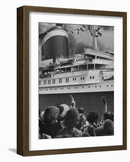 The Ship United States, under Flags, Going on First Trip, with Passengers Waving to Those on Shore-Frank Scherschel-Framed Photographic Print