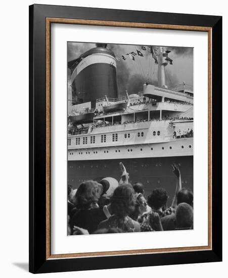 The Ship United States, under Flags, Going on First Trip, with Passengers Waving to Those on Shore-Frank Scherschel-Framed Photographic Print