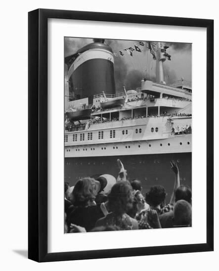 The Ship United States, under Flags, Going on First Trip, with Passengers Waving to Those on Shore-Frank Scherschel-Framed Photographic Print