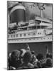 The Ship United States, under Flags, Going on First Trip, with Passengers Waving to Those on Shore-Frank Scherschel-Mounted Photographic Print