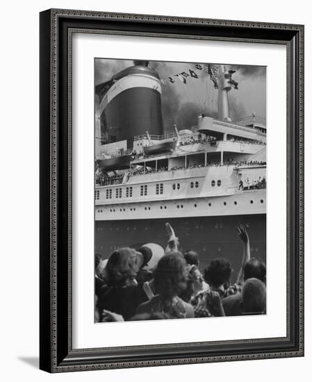 The Ship United States, under Flags, Going on First Trip, with Passengers Waving to Those on Shore-Frank Scherschel-Framed Photographic Print