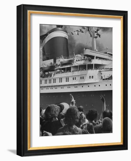 The Ship United States, under Flags, Going on First Trip, with Passengers Waving to Those on Shore-Frank Scherschel-Framed Photographic Print
