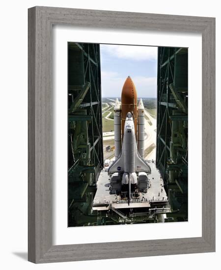 The Space Shuttle Discovery Begins Its Six Hour Trek from the Vehicle Assembly Building-null-Framed Photographic Print