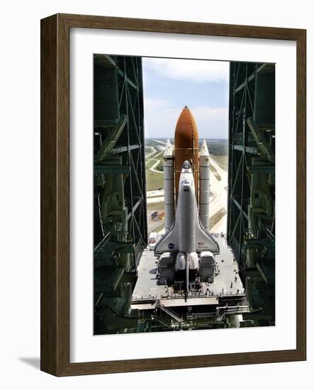 The Space Shuttle Discovery Begins Its Six Hour Trek from the Vehicle Assembly Building-null-Framed Photographic Print