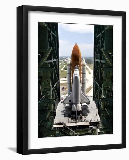 The Space Shuttle Discovery Begins Its Six Hour Trek from the Vehicle Assembly Building-null-Framed Photographic Print