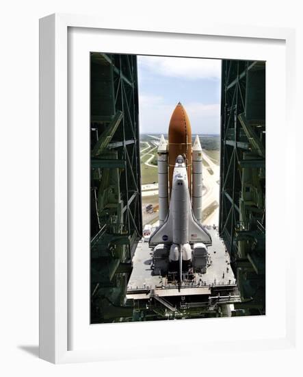 The Space Shuttle Discovery Begins Its Six Hour Trek from the Vehicle Assembly Building-null-Framed Photographic Print