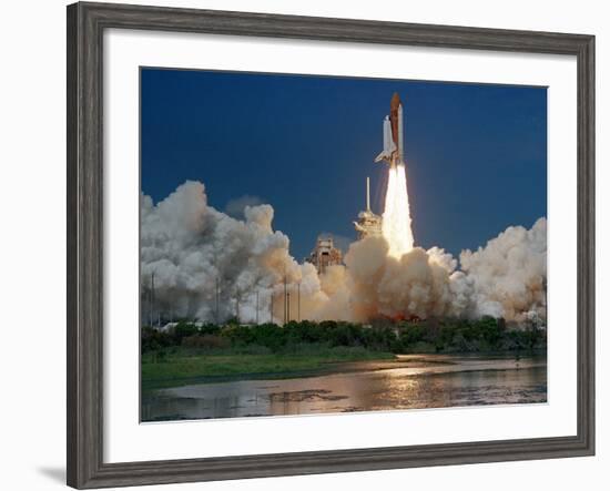 The Space Shuttle Discovery Rises from the Swamps Surrounding its Pad at Kennedy Space Center-null-Framed Photographic Print