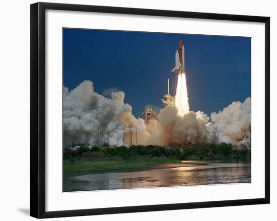 The Space Shuttle Discovery Rises from the Swamps Surrounding its Pad at Kennedy Space Center-null-Framed Photographic Print