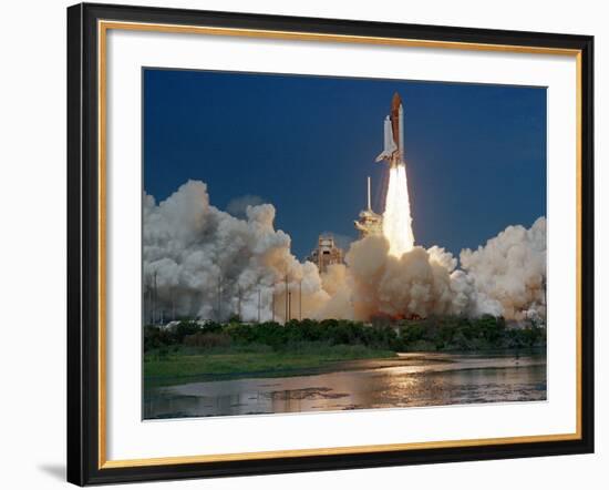 The Space Shuttle Discovery Rises from the Swamps Surrounding its Pad at Kennedy Space Center-null-Framed Photographic Print