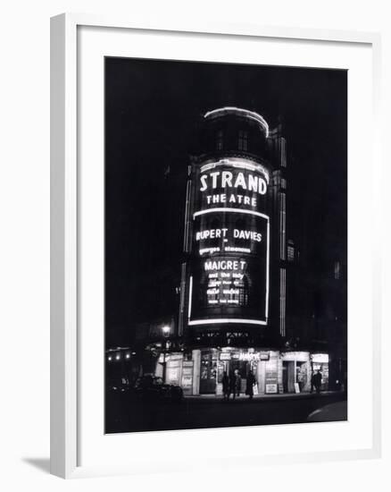 The Strand Theatre, London is Lit up at Night to Advertise the Play Maigret Starring Rupert Davies-null-Framed Photographic Print