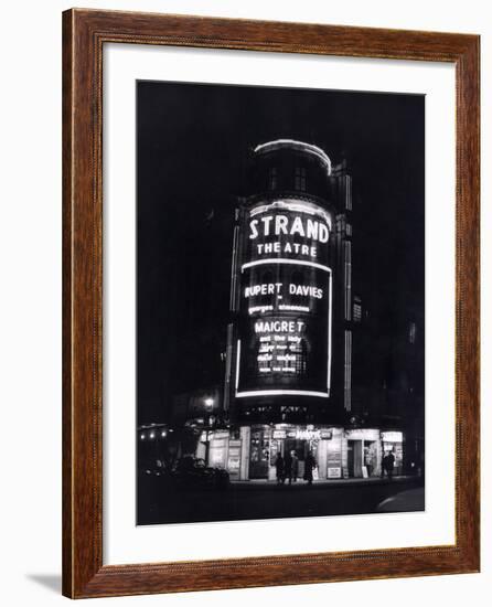 The Strand Theatre, London is Lit up at Night to Advertise the Play Maigret Starring Rupert Davies-null-Framed Photographic Print