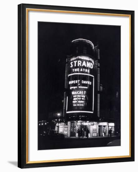 The Strand Theatre, London is Lit up at Night to Advertise the Play Maigret Starring Rupert Davies-null-Framed Photographic Print