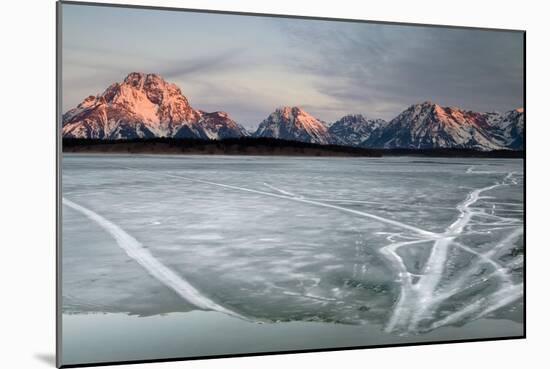 The Sunrises Over The Tetons And An Ice Covered Jackson Lake In Grand Teton National Park, Wyoming-Jay Goodrich-Mounted Photographic Print