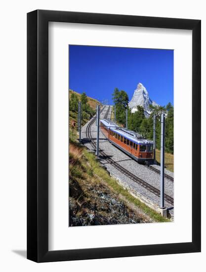 The Swiss Bahn Train Runs on its Route with the Matterhorn in the Background, Switzerland-Roberto Moiola-Framed Photographic Print