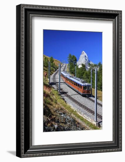 The Swiss Bahn Train Runs on its Route with the Matterhorn in the Background, Switzerland-Roberto Moiola-Framed Photographic Print