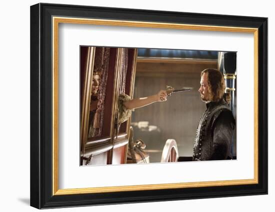 THE THREE MUSKETEERS (L-R) MILLA JOVOVICH and MATTHEW MACFADYEN star in THE THREE MUSKETEERS 3D. (p-null-Framed Photo