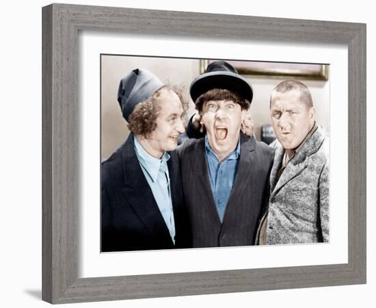 The Three Stooges, from left: Larry Fine, Moe Howard, Curly Howard, ca. 1943-null-Framed Photo