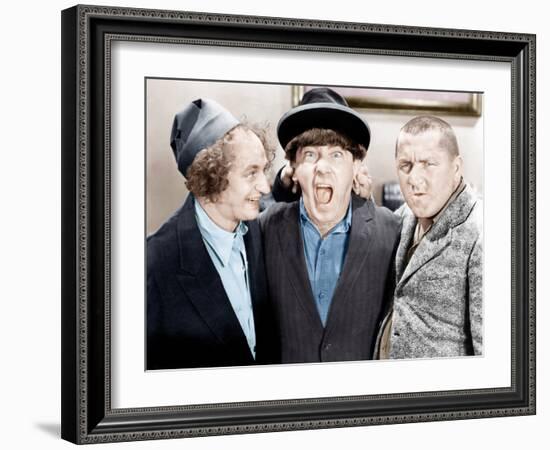 The Three Stooges, from left: Larry Fine, Moe Howard, Curly Howard, ca. 1943-null-Framed Photo