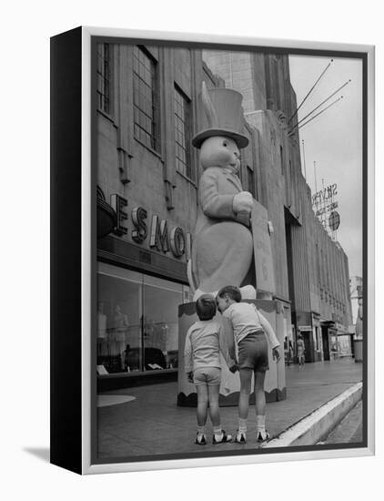 The Toll Brothers Admiring 6 Ft. Easter Bunny-Bob Landry-Framed Premier Image Canvas