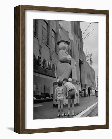 The Toll Brothers Admiring 6 Ft. Easter Bunny-Bob Landry-Framed Photographic Print