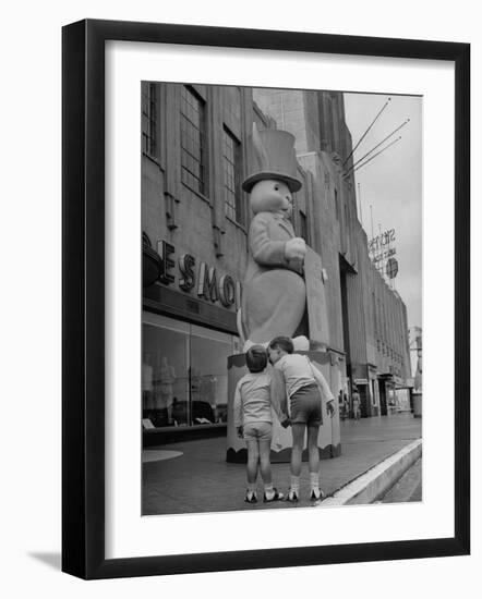 The Toll Brothers Admiring 6 Ft. Easter Bunny-Bob Landry-Framed Photographic Print