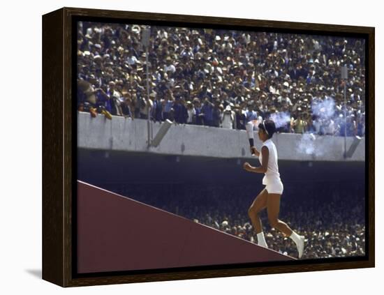 The Torch Being Carried Up the Steps in the Olympic Stadium at the Summer Olympics-John Dominis-Framed Premier Image Canvas