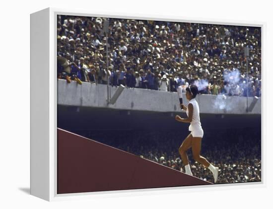 The Torch Being Carried Up the Steps in the Olympic Stadium at the Summer Olympics-John Dominis-Framed Premier Image Canvas