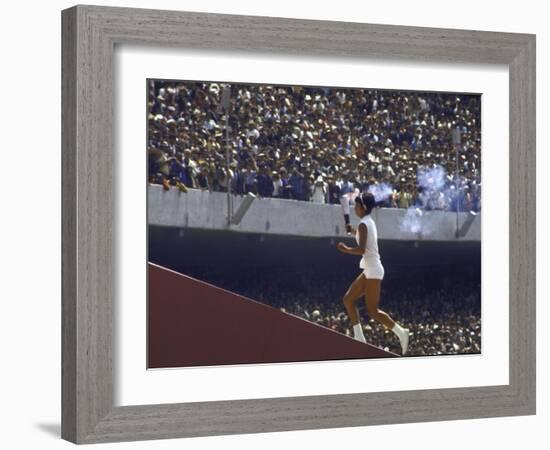 The Torch Being Carried Up the Steps in the Olympic Stadium at the Summer Olympics-John Dominis-Framed Photographic Print