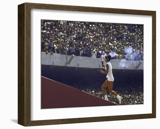 The Torch Being Carried Up the Steps in the Olympic Stadium at the Summer Olympics-John Dominis-Framed Photographic Print