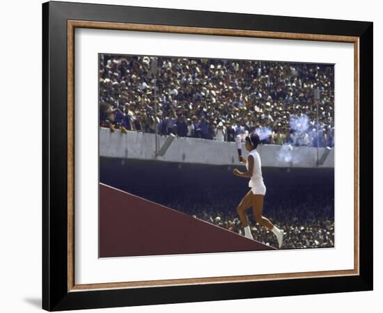 The Torch Being Carried Up the Steps in the Olympic Stadium at the Summer Olympics-John Dominis-Framed Photographic Print