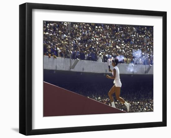 The Torch Being Carried Up the Steps in the Olympic Stadium at the Summer Olympics-John Dominis-Framed Photographic Print