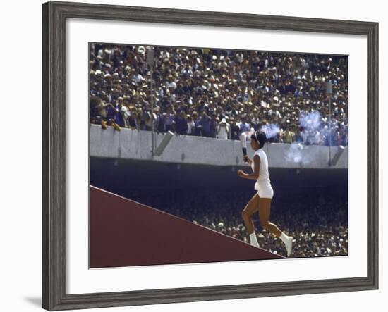 The Torch Being Carried Up the Steps in the Olympic Stadium at the Summer Olympics-John Dominis-Framed Photographic Print