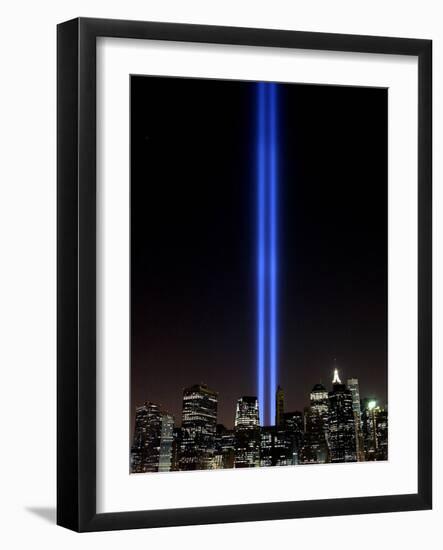 The Tribute of Light Memorial Shines into the Sky Over the Night Skyline of New York City-null-Framed Photographic Print