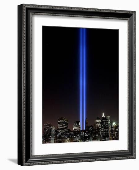 The Tribute of Light Memorial Shines into the Sky Over the Night Skyline of New York City-null-Framed Photographic Print