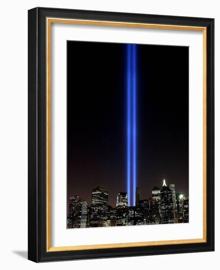 The Tribute of Light Memorial Shines into the Sky Over the Night Skyline of New York City-null-Framed Photographic Print