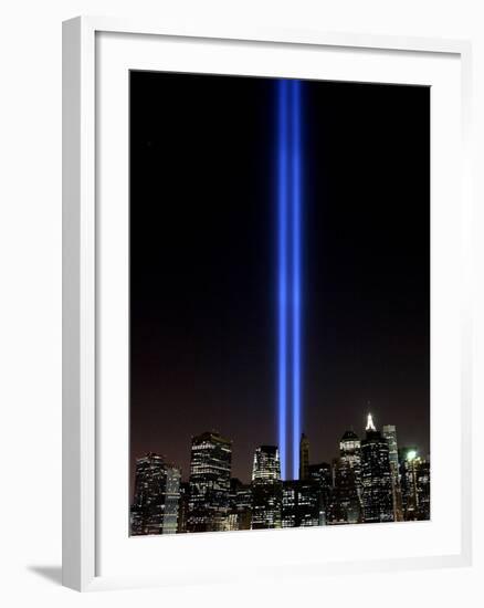 The Tribute of Light Memorial Shines into the Sky Over the Night Skyline of New York City-null-Framed Photographic Print