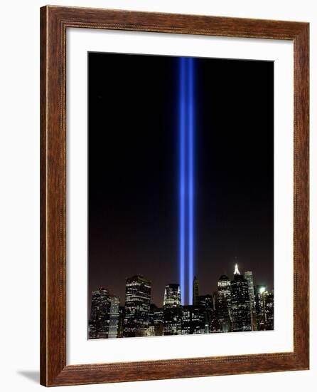 The Tribute of Light Memorial Shines into the Sky Over the Night Skyline of New York City-null-Framed Photographic Print