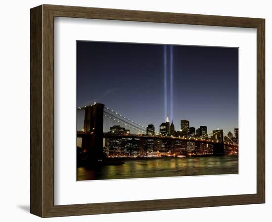 The Tribute of Light Memorial Shines into the Sky Over the Night Skyline of New York City-null-Framed Photographic Print