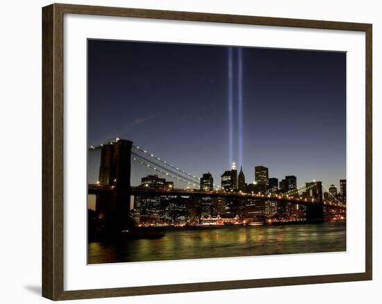 The Tribute of Light Memorial Shines into the Sky Over the Night Skyline of New York City-null-Framed Photographic Print