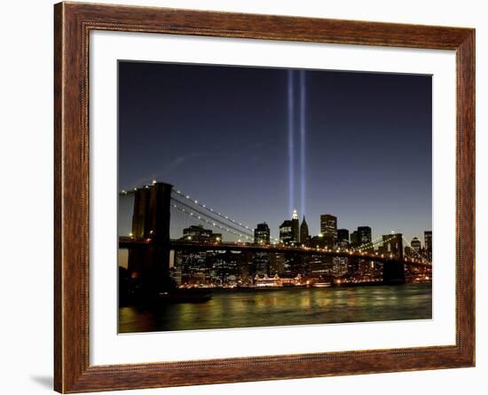 The Tribute of Light Memorial Shines into the Sky Over the Night Skyline of New York City-null-Framed Photographic Print