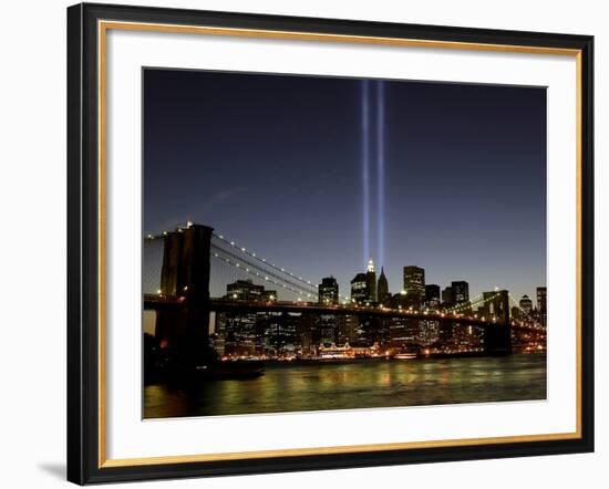 The Tribute of Light Memorial Shines into the Sky Over the Night Skyline of New York City-null-Framed Photographic Print