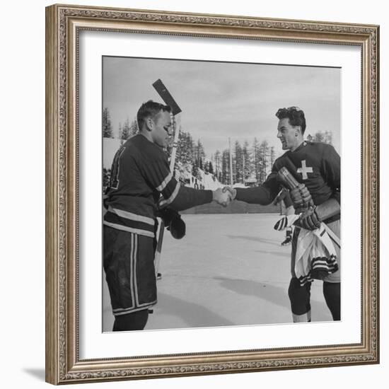 The Usa Team Giving the Swiss a Sweater and a Friendly Handshake before the Game-Mark Kauffman-Framed Premium Photographic Print
